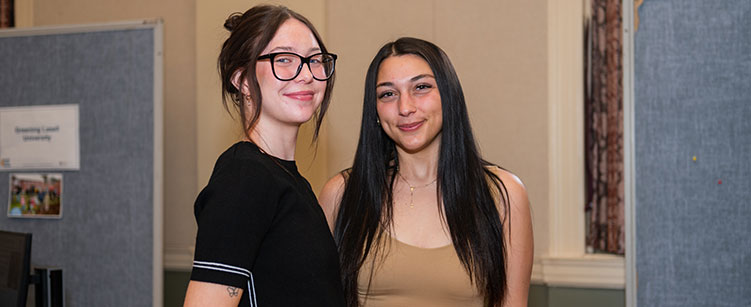 two students at symposium